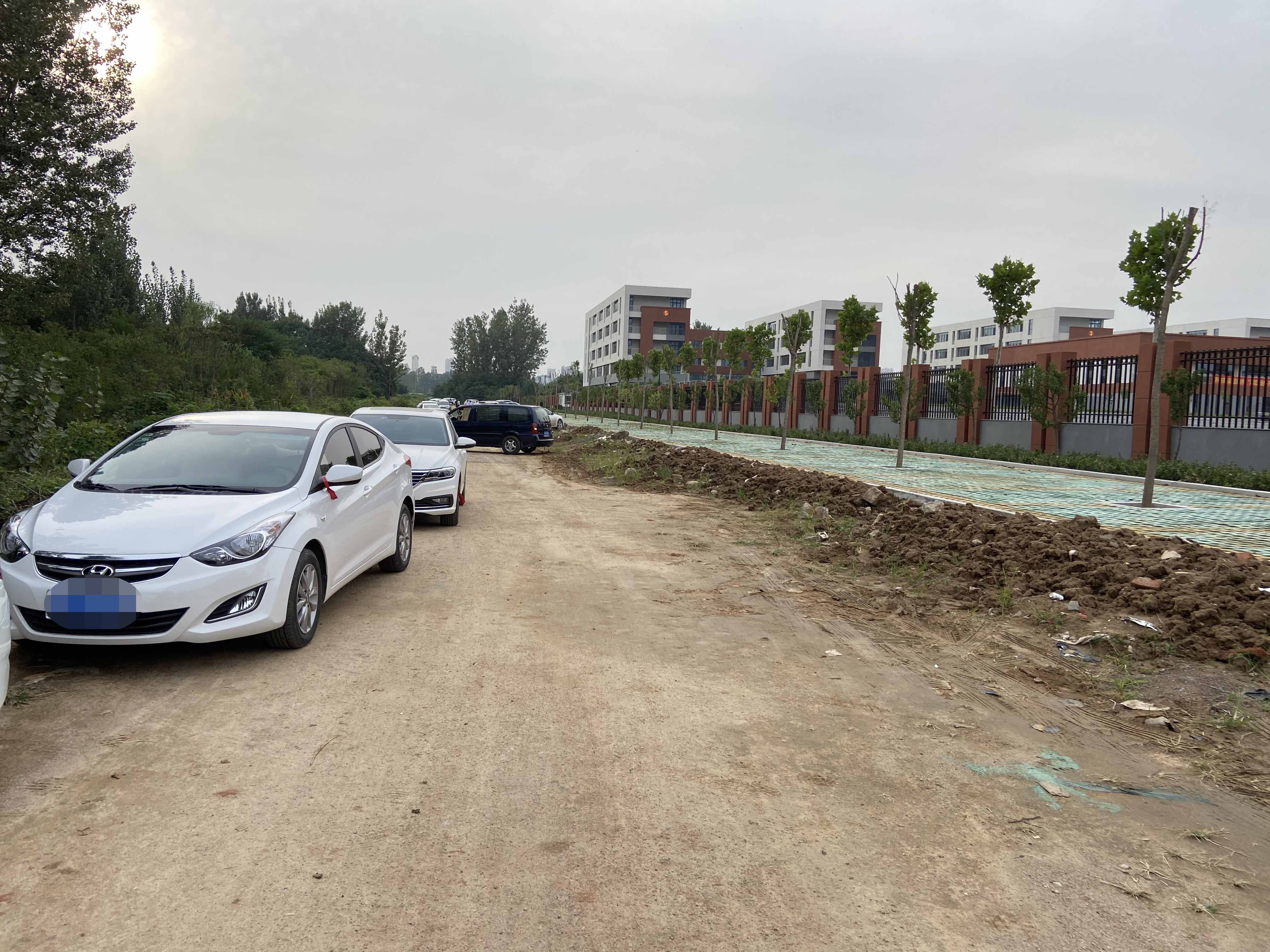 公益修路好 爱心护成长|玉龙湾开发商投资建设的高新区实验学校南门道路已竣工(图2)